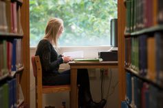 An IUSB student studies in the library.